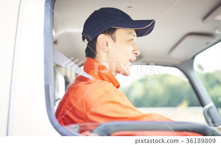 A man driving 36189809