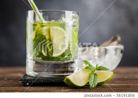 Mojito cocktail on dark background Mojito cocktail on dark background 36191808