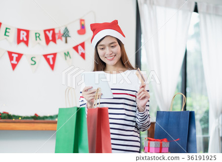 Asia woman use credit card buy Christmas gift  36191925