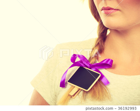Teenage girl having little blackboard in hair 36192993