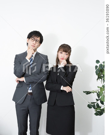 Standing man and woman wearing a suit 36193890