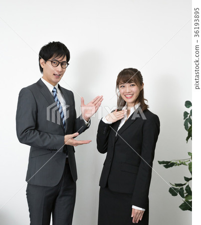 Standing man and woman wearing a suit 36193895