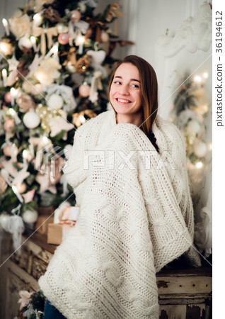 Woman with a Christmas Gift sitting on acncient 36194612