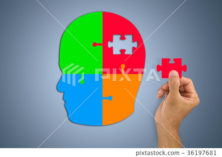 Hand inserting missing jigsaw in man's head Hand inserting missing jigsaw in man's head 36197681