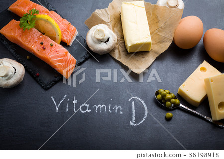 Black slate table with product rich in vitamin D. 36198918