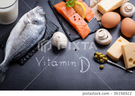 Black slate table with product rich in vitamin D. 36198922
