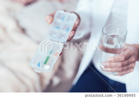 Qualified medical doctor demonstrating medicaments Qualified medical doctor demonstrating medicaments 36199995