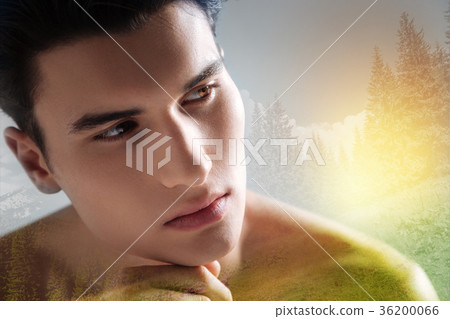 Thoughtful young man looking into the distance Thoughtful young man looking into the distance 36200066