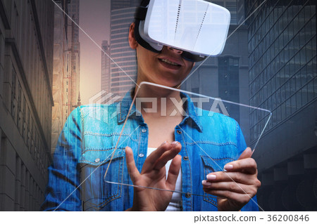 Smiling woman playing a new game on her 36200846