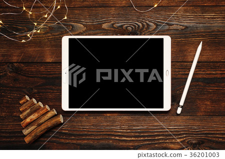 white tablet on a christmas wooden background with 36201003