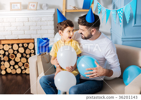 Pleasant father and son holding balloons and Pleasant father and son holding balloons and 36201143