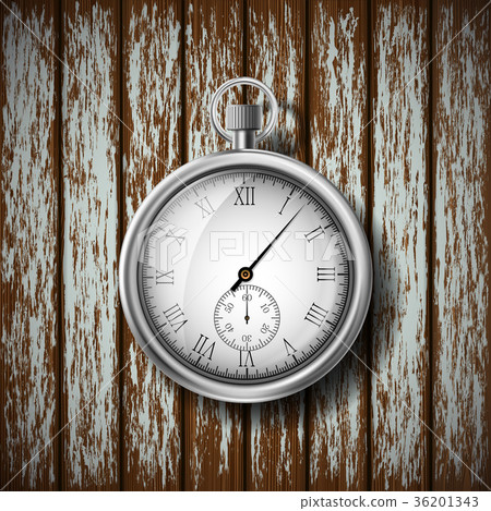 pocket watch lying on a wooden surface pocket watch lying on a wooden surface 36201343