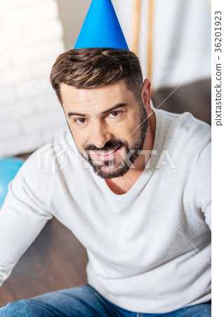 Top view of handsome young man in party hat Top view of handsome young man in party hat 36201923