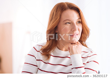 Nice smiling blond woman thinking 36203117