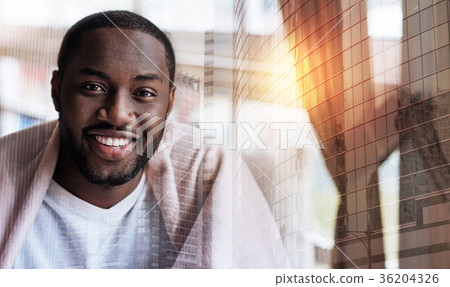 Handsome alert young man smiling 36204326