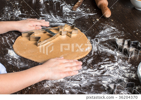 Cutting dough on different shapes. gingerbread Cutting dough on different shapes. gingerbread 36204370