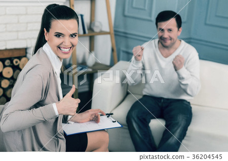 Positive delighted people looking at camera Positive delighted people looking at camera 36204545