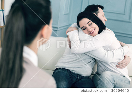 Happy loving couple sitting together 36204640