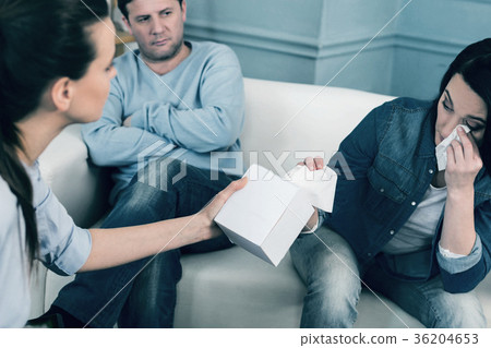 Kind woman giving napkins to her client 36204653