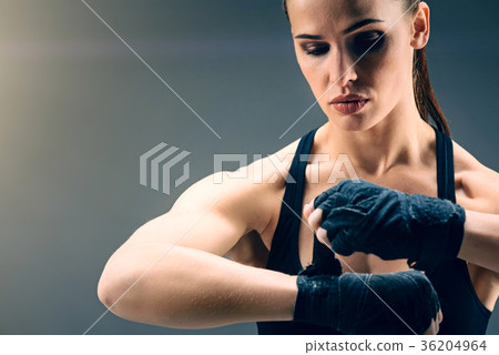Scaled up look on beautiful female boxer wrapping 36204964