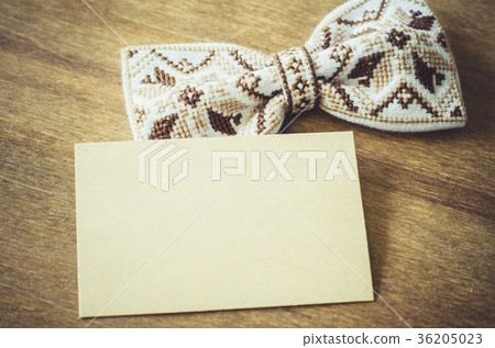 Bow Tie and Empty Card on Wooden Background. Bow Tie and Empty Card on Wooden Background. 36205023