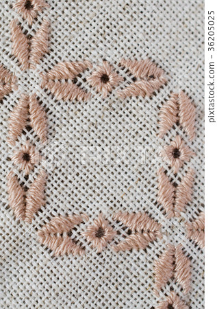 Craft embroidery by brown and beige threads. Craft embroidery by brown and beige threads. 36205025