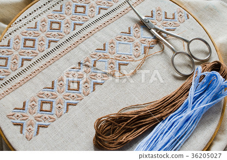 Embroidery hoop with fragment embroidered fabric. Embroidery hoop with fragment embroidered fabric. 36205027