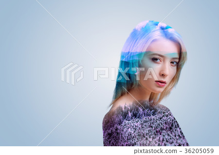 Beautiful young woman looking into camera dreamily 36205059