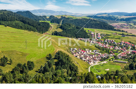 Slovakian town on grassy hillside in summer 36205182