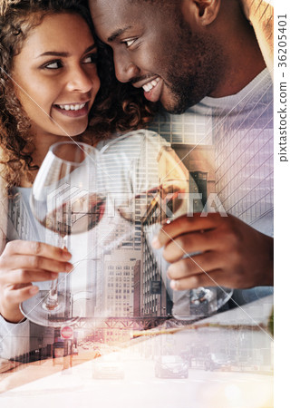 Delighted young couple drinking wine 36205401