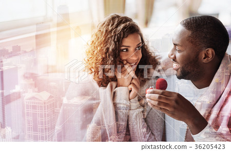 Close up of lovely couple with heart shaped box Close up of lovely couple with heart shaped box 36205423