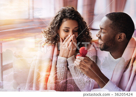 Delighted man proposing to his woman Delighted man proposing to his woman 36205424