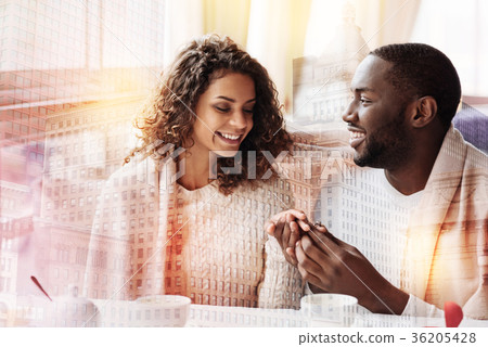 Beautiful woman looking at the wedding ring on her Beautiful woman looking at the wedding ring on her 36205428