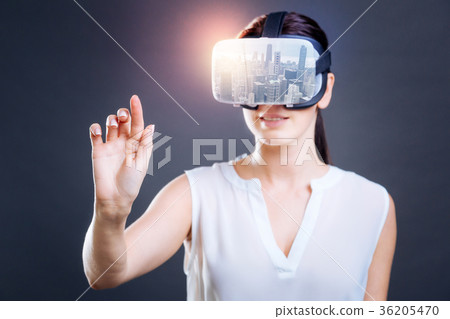 Excited woman looking through virtual mask Excited woman looking through virtual mask 36205470