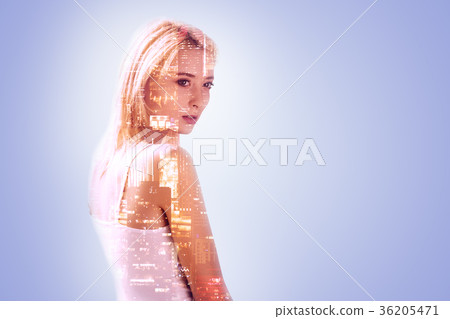 Pleasant thoughtful woman standing against blue Pleasant thoughtful woman standing against blue 36205471