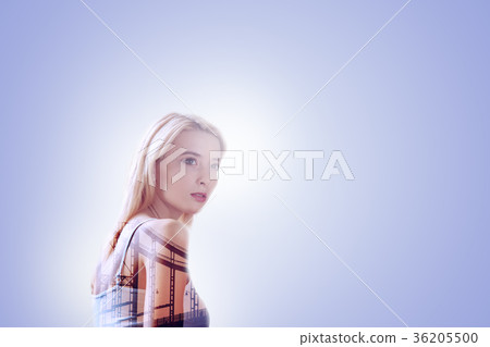 Nice attractive woman standing against blue Nice attractive woman standing against blue 36205500
