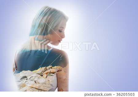 Pleasant nice woman thinking about the mountains 36205503