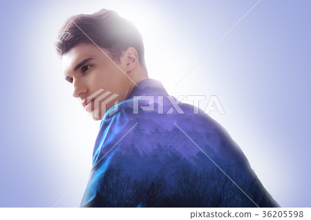 Serious young man being involved in thoughts Serious young man being involved in thoughts 36205598