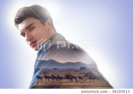Smart young man thinking about animals Smart young man thinking about animals 36205613