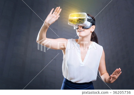 Pretty good looking woman scrutinizing her arm in 36205736