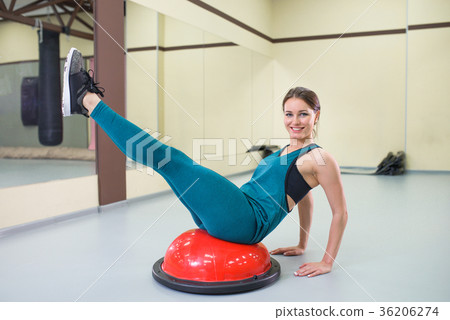 Sport woman exercise with a pilates ball at gym Sport woman exercise with a pilates ball at gym 36206274