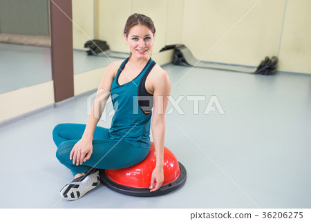 Sport woman exercise with a pilates ball at gym Sport woman exercise with a pilates ball at gym 36206275