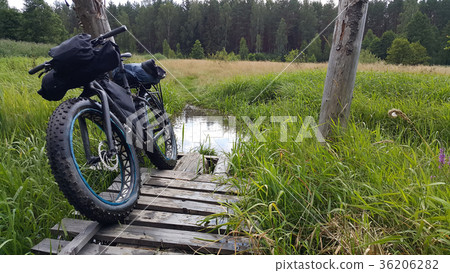 fatbike in the swamp on the old bridge 36206282
