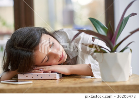 Young female student at the library 36206478