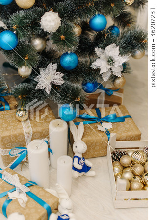 Brown present boxes decorated with ribbons stand 36207231