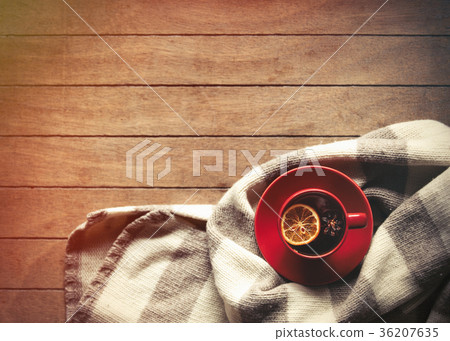Cup of tea with lemon and scarf 36207635