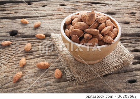 group of almonds from wood bowl group of almonds from wood bowl 36208662