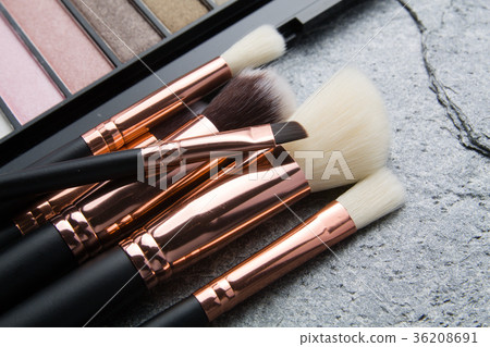various makeup products on dark background 36208691