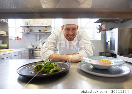 happy male chef cooking food at restaurant kitchen 36211334