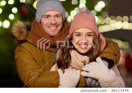 happy couple hugging at christmas tree 36211976